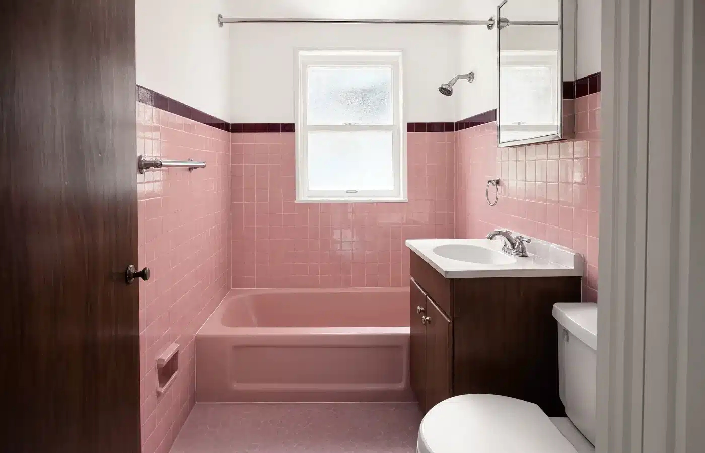 An original 1970s pink tile bathroom, clean and intact, ready for a remodel rather than a repair